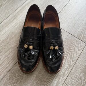 Stuart Weitzman Black Loafers with Gold Accents
